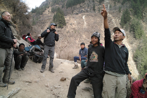 Tenzing Sherpa pointing out some loose rocks