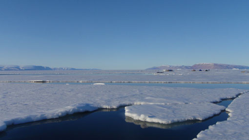 Our camp in the distance beside the melting ice edge